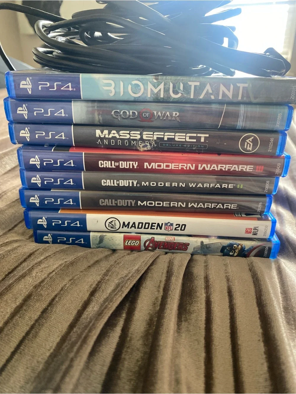 Sony PS4 Console with Black and Blue DualShock Controllers and Game Stack